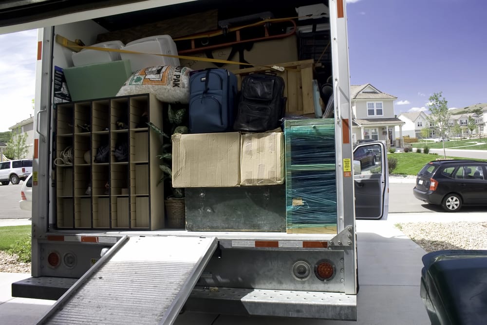 Large truck packed neatly with items of a home